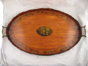 Appraisal: A late Georgian Regency oval satinwood veneered tray with undulating