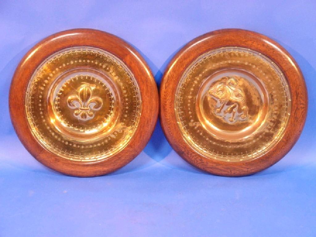 Appraisal: A pair of large brass chargers one embossed with a