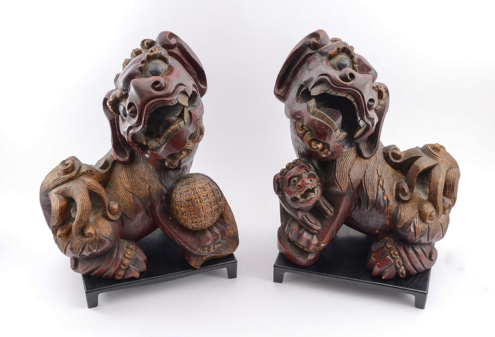 Appraisal: PAIR ORIENTAL CARVED WOOD FOO DOGS Male and female foo