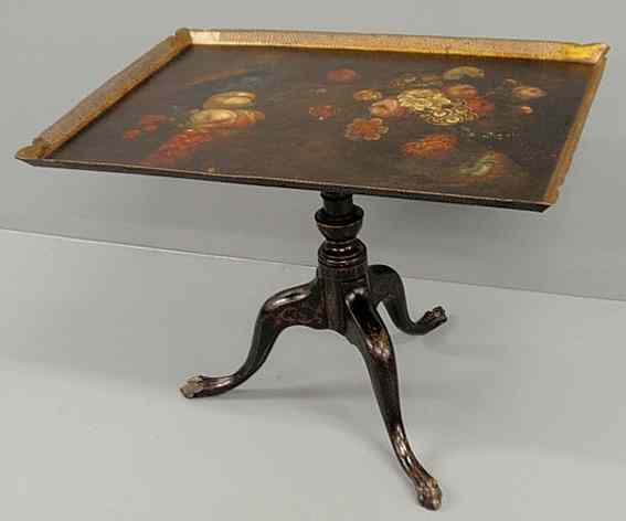 Appraisal: Tole decorated tray-top table with a wood base with turned