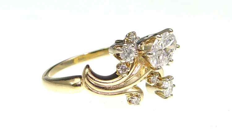 Appraisal: CT DIAMOND DRESS RING K yellow gold ring featuring an