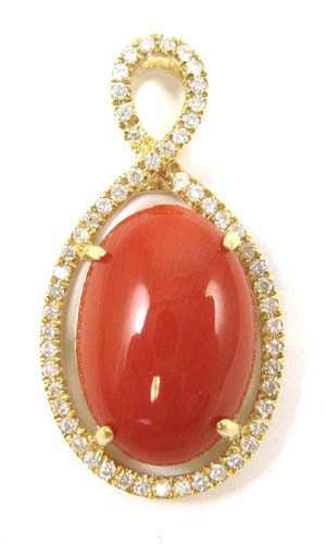 Appraisal: CORAL DIAMOND AND FOURTEEN KARAT GOLD PENDANT with round-cut diamonds