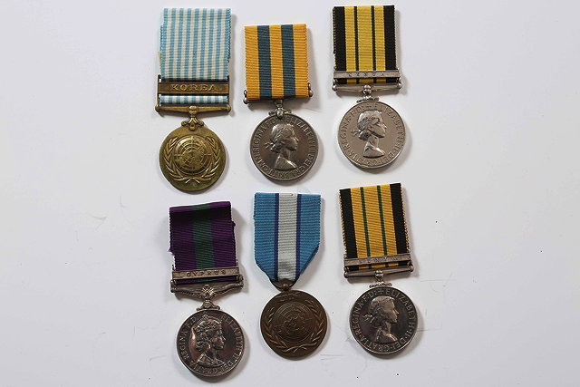 Appraisal: A GROUP OF THREE MEDALS awarded to Private J Henderson