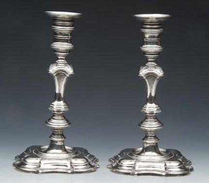 Appraisal: A PAIR OF TH CENTURY CAST SILVER CANDLESTICKS with loose