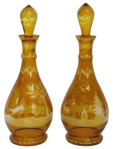 Appraisal: pair Bohemian amber cut-to-clear glass decanters each having narrow neck