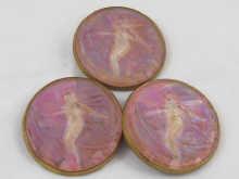 Appraisal: Three large Russian brass backed lustre glass buttons moulded as