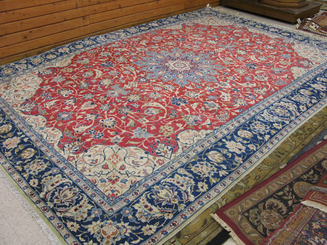 Appraisal: PERSIAN NAJAFABAD CARPET floral and central floral medallion design on