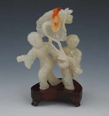 Appraisal: A Carved Jadeite Figural of Two Boys Chinese Beautifully carved