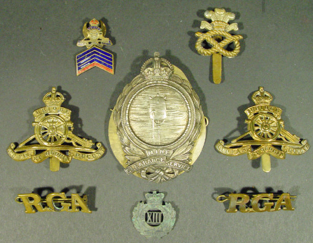 Appraisal: Small group of military badges and pips including The Mine