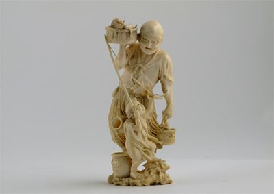 Appraisal: A Japanese Tokyo school ivory carving of an old fisherman