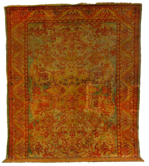 Appraisal: Oushak carpet ca with overall floral design on a green