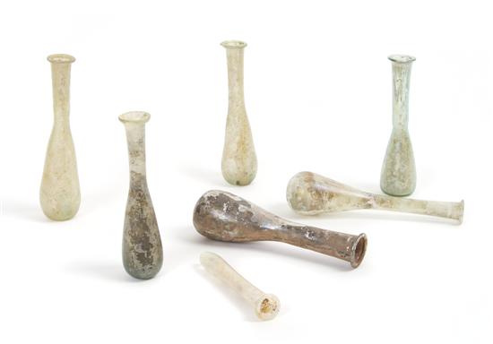 Appraisal: A Collection of Seven Roman Glass Unguentariums Height of tallest