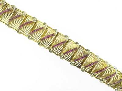 Appraisal: An unusual ruby set gold bracelet Comprising rectangular raised pierced