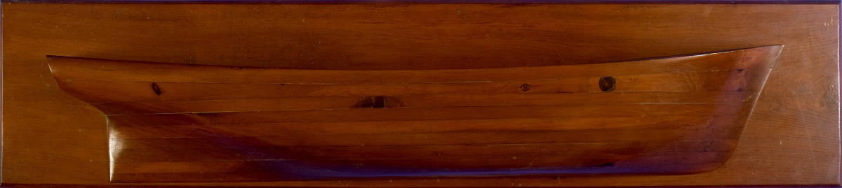 Appraisal: HALF-HULL MODEL OF PLANK CONSTRUCTION Mounted on a pine backboard