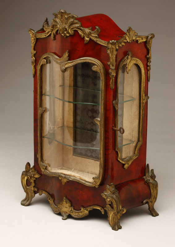 Appraisal: A Louis XV style gilt bronze-mounted tortoiseshell-veneered miniature vitrine cabinet