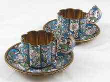 Appraisal: A pair of Russian enamelled silver gilt cups and saucers