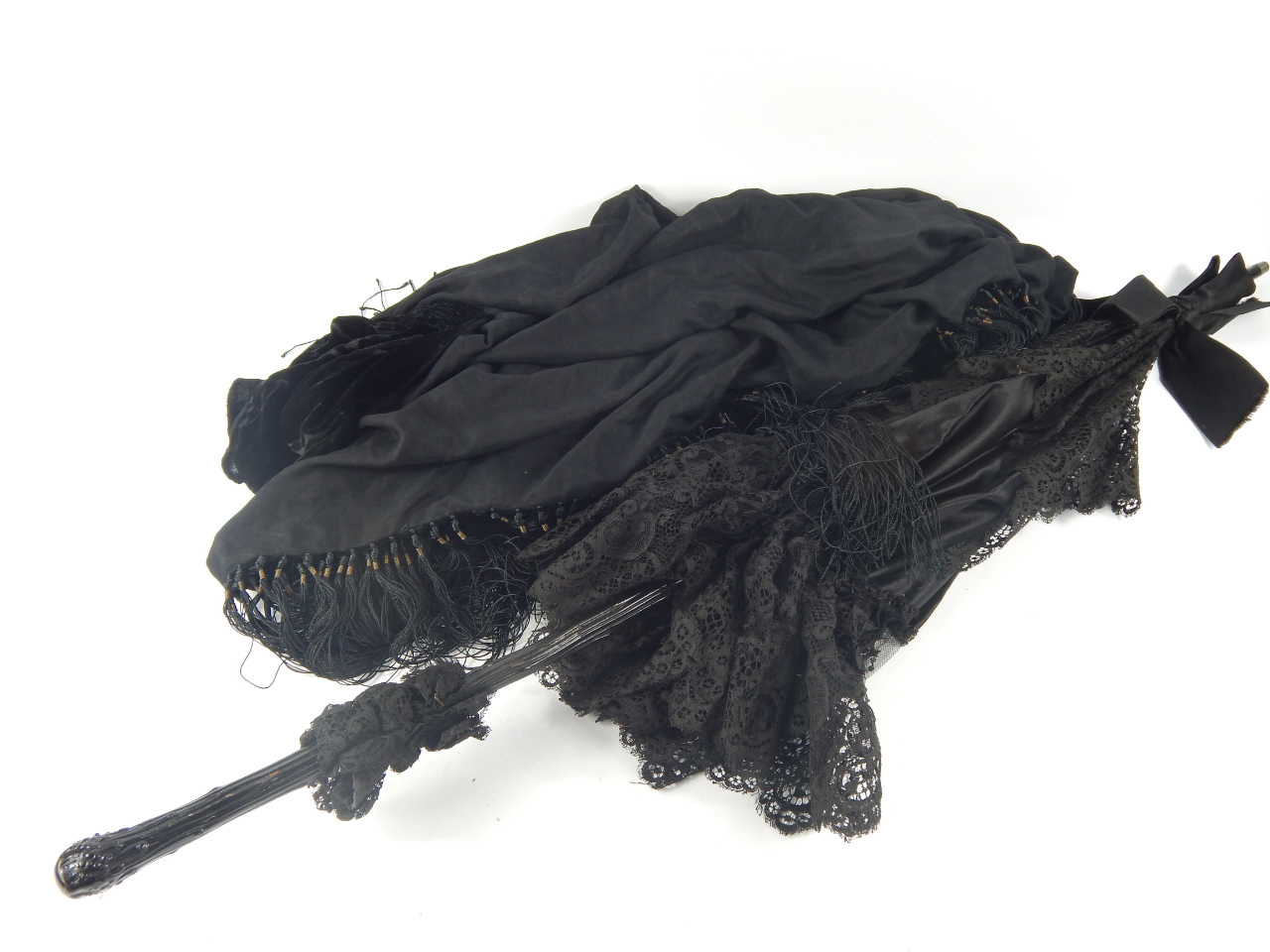 Appraisal: A Victorian black silk and lace parasol with a faux