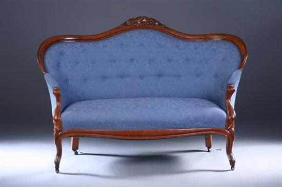 Appraisal: PAIR ROCOCO REVIVAL WALNUT LOVESEATS th century with tufted blue