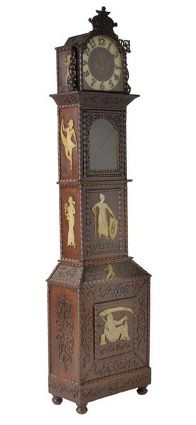 Appraisal: TRAMP ART GRANDFATHER CLOCK With fretwork decoration and applied mythological