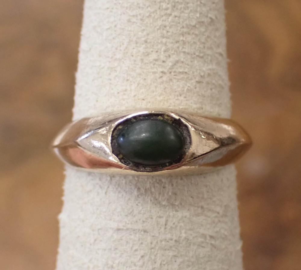 Appraisal: GREEN HARDSTONE AND FOURTEEN KARAT GOLD RING The yellow gold