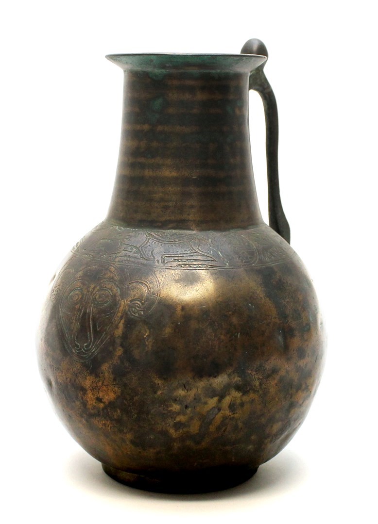 Appraisal: An early Islamic bronze jug Iran c th century with