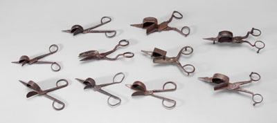 Appraisal: Ten iron candle snuffers all hand forged some with shaped