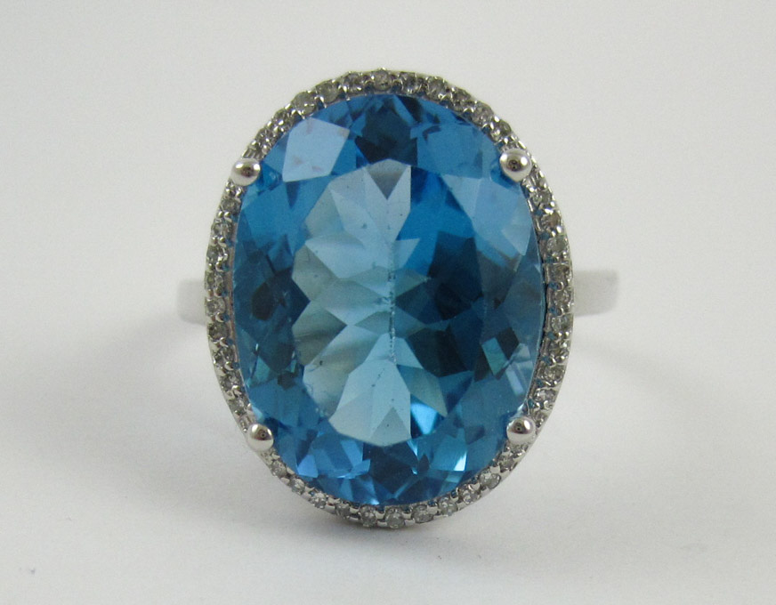 Appraisal: FOURTEEN KARAT WHITE GOLD DIAMOND AND TOPAZ RING the approximately