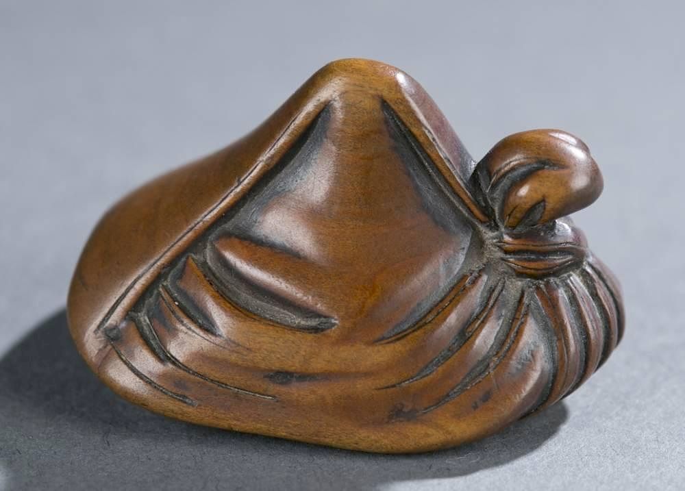 Appraisal: Japanese wood tengu mask netsuke th Century A Japanese wood