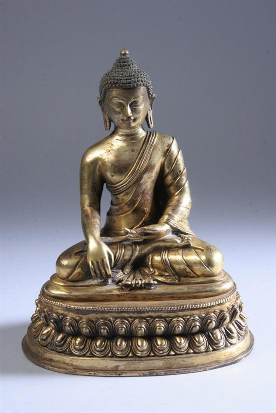 Appraisal: TIBETAN GILT BRONZE FIGURE OF AKSOBHA BUDDHA Seated in dhyanasana