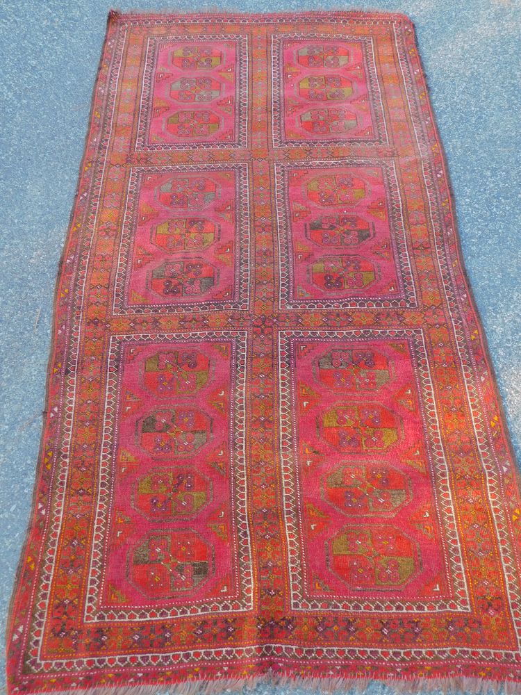 Appraisal: ANTIQUE TURKOMAN RUG Antique Turkoman rug in reds and orange