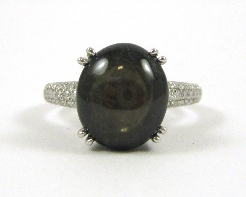 Appraisal: BLACK STAR SAPPHIRE AND DIAMOND RING The k white gold