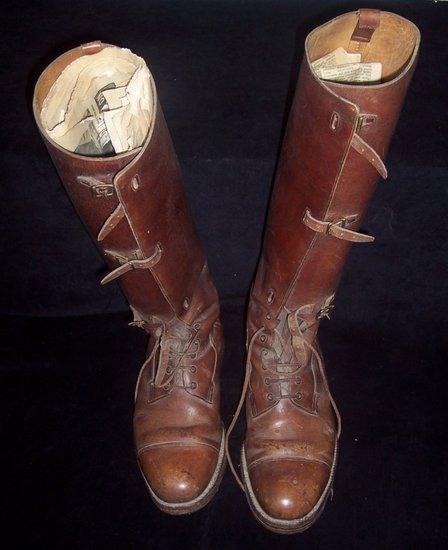 Appraisal: A pair of brown leather riding boots with buckles and