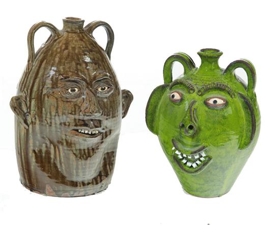 Appraisal: TWO GROTESQUE JUGS American th century Ash glaze inscribed ''Shelby