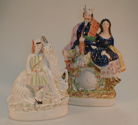 Appraisal: A Victorian Staffordshire clock group figure and another