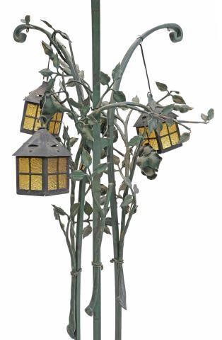 Appraisal: Wrought iron three-light floor lamp th c having three scrolled