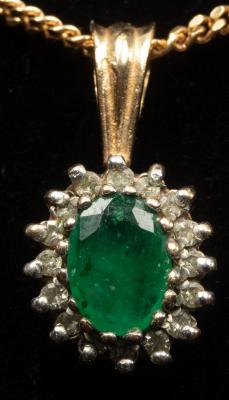 Appraisal: An emerald and diamond cluster pendant on a fine ct