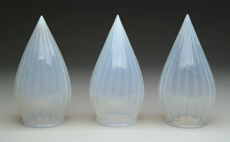 Appraisal: THREE OPALESCENT BULLET SHADES Lovely opalescent bullet shades have ribbed