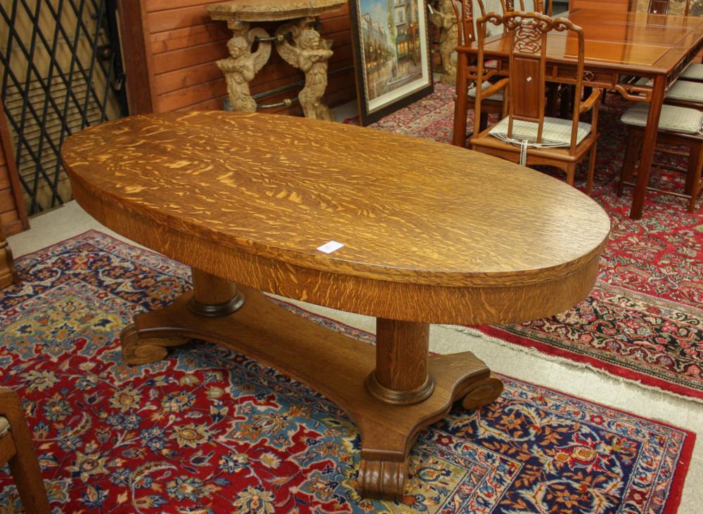 Appraisal: OAK CENTER TABLE Empire Revival design American c oval top