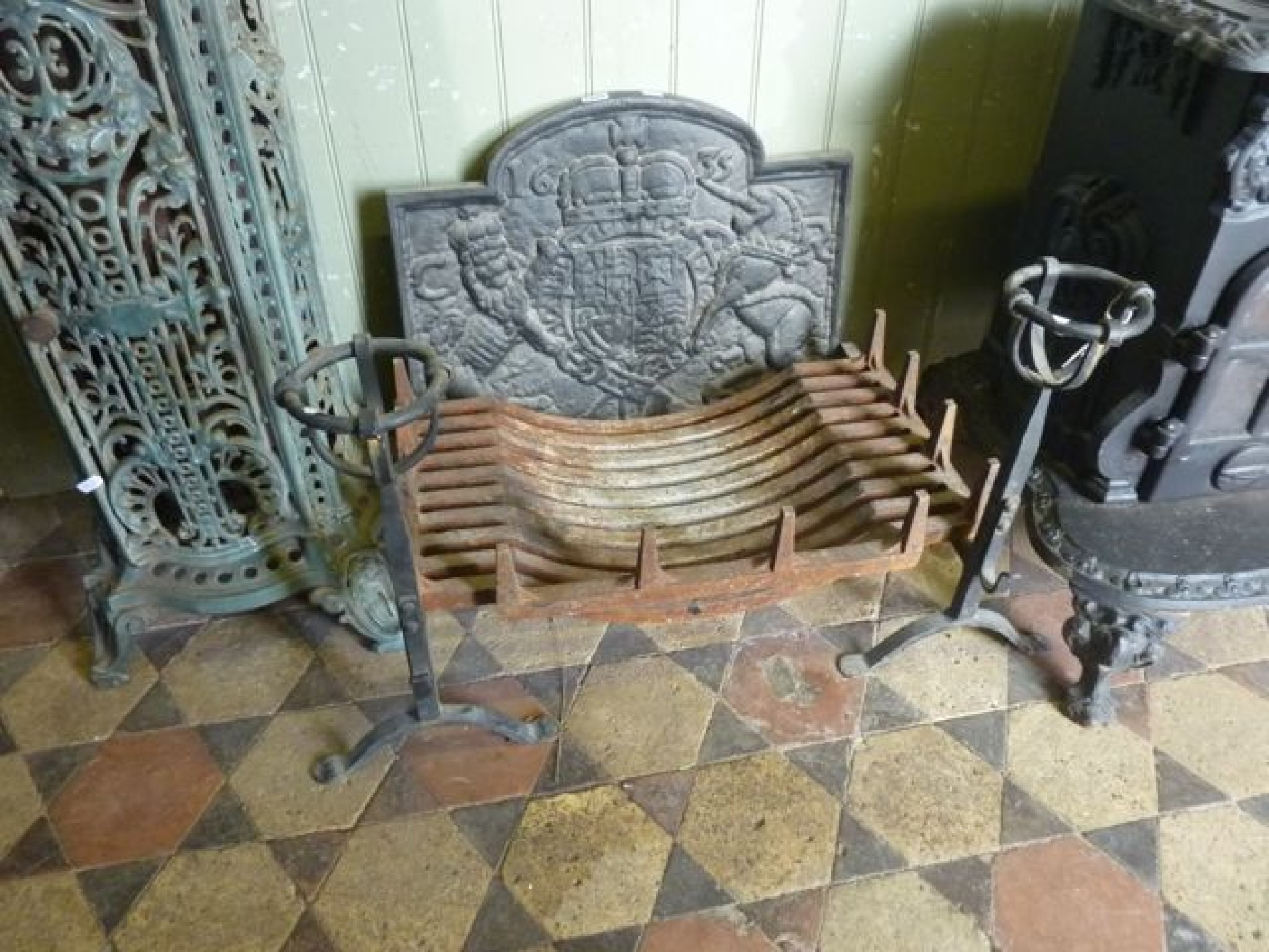 Appraisal: An old English style fire basket complete with fire dogs