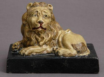 Appraisal: WOOD AND CALDWELL FIGURE OF A RECUMBENT LION Modeled with