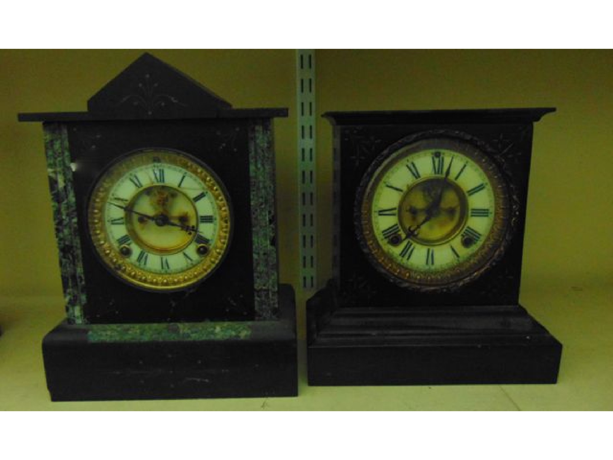 Appraisal: A th century black slate and marble mantle clock the