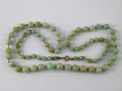 Appraisal: A graduated jade bead necklace beads approx - mm necklace