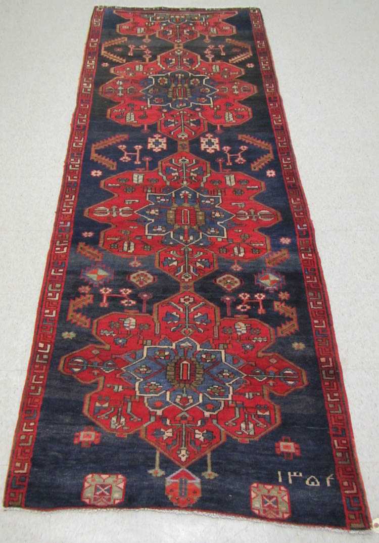 Appraisal: SEMI-ANTIQUE PERSIAN TRIBAL AREA RUG Kazak geometric medallion design on