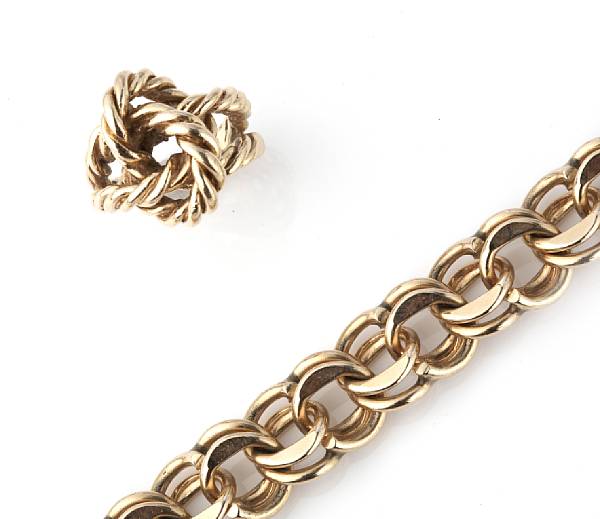 Appraisal: A k gold charm bracelet with a k gold knot