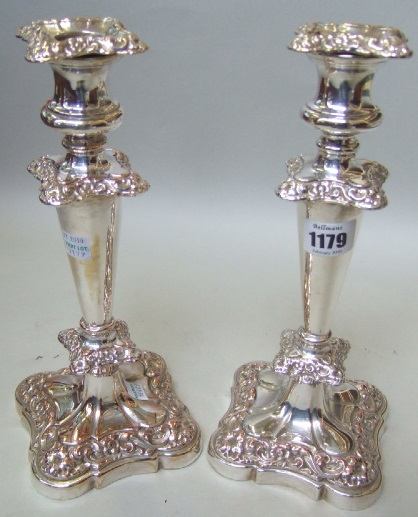 Appraisal: A pair of plated on copper table candlesticks with floral