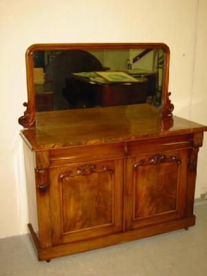 Appraisal: A VICTORIAN MAHOGANY MIRROR BACKED SIDEBOARD the rounded oblong plate