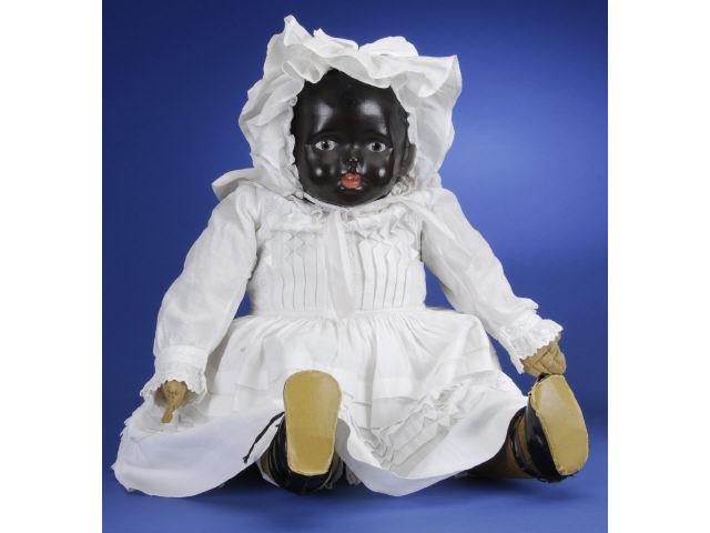 Appraisal: Black Pressed Cloth Doll America ca black pressed cloth shoulder