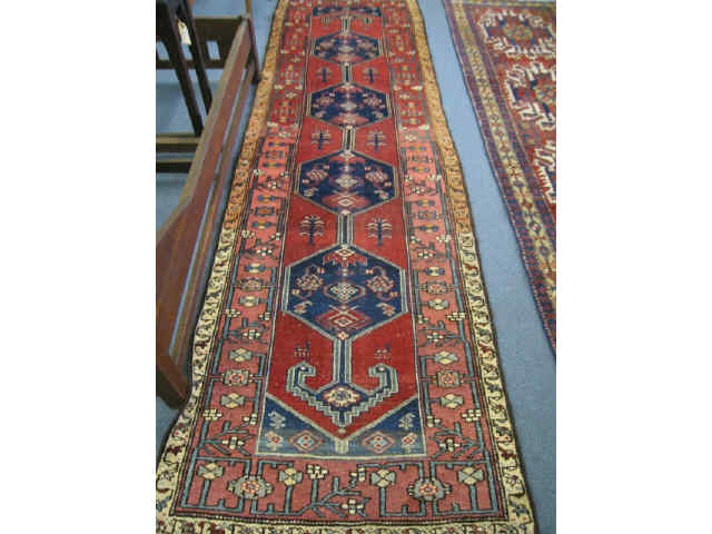 Appraisal: Kord Persian Handmade Runner four medallions on red field interesting