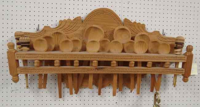 Appraisal: Primitive wooden utensil rack with various utensils '' Wide