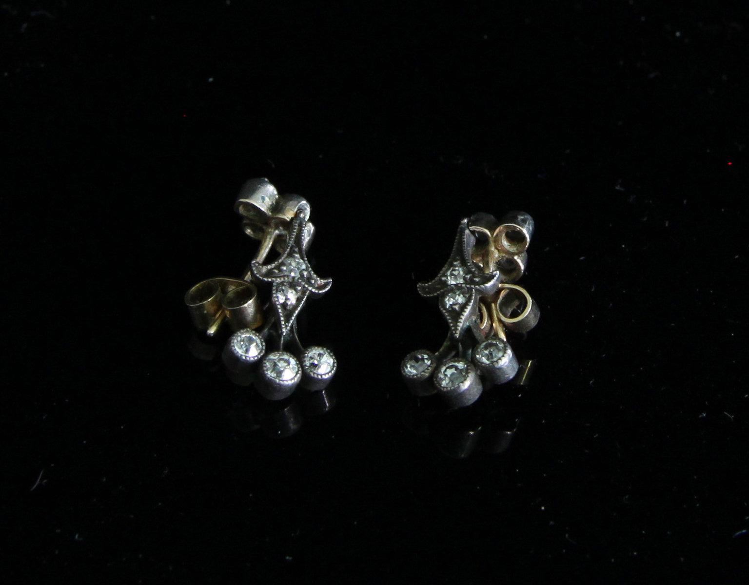 Appraisal: A pair of diamond drop earrings each of quatrefoil form